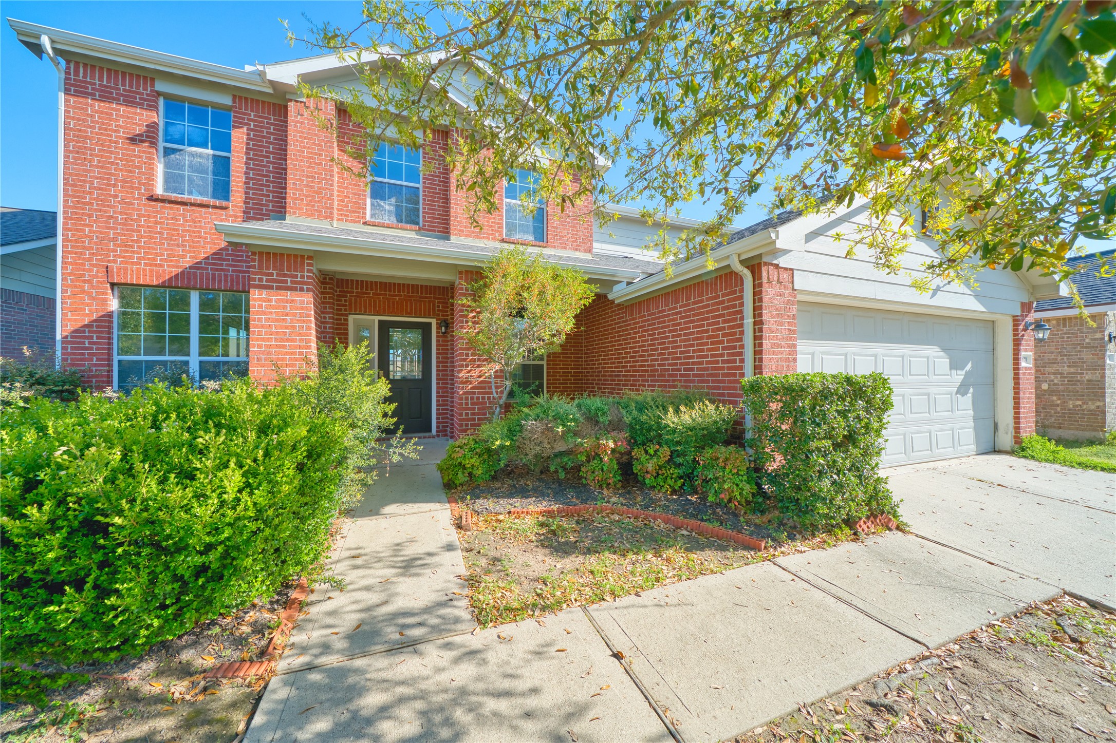6610 Autumn Sunset Lane Spring, TX 77379 - Photo 4 of 45 a front view of a house with garden