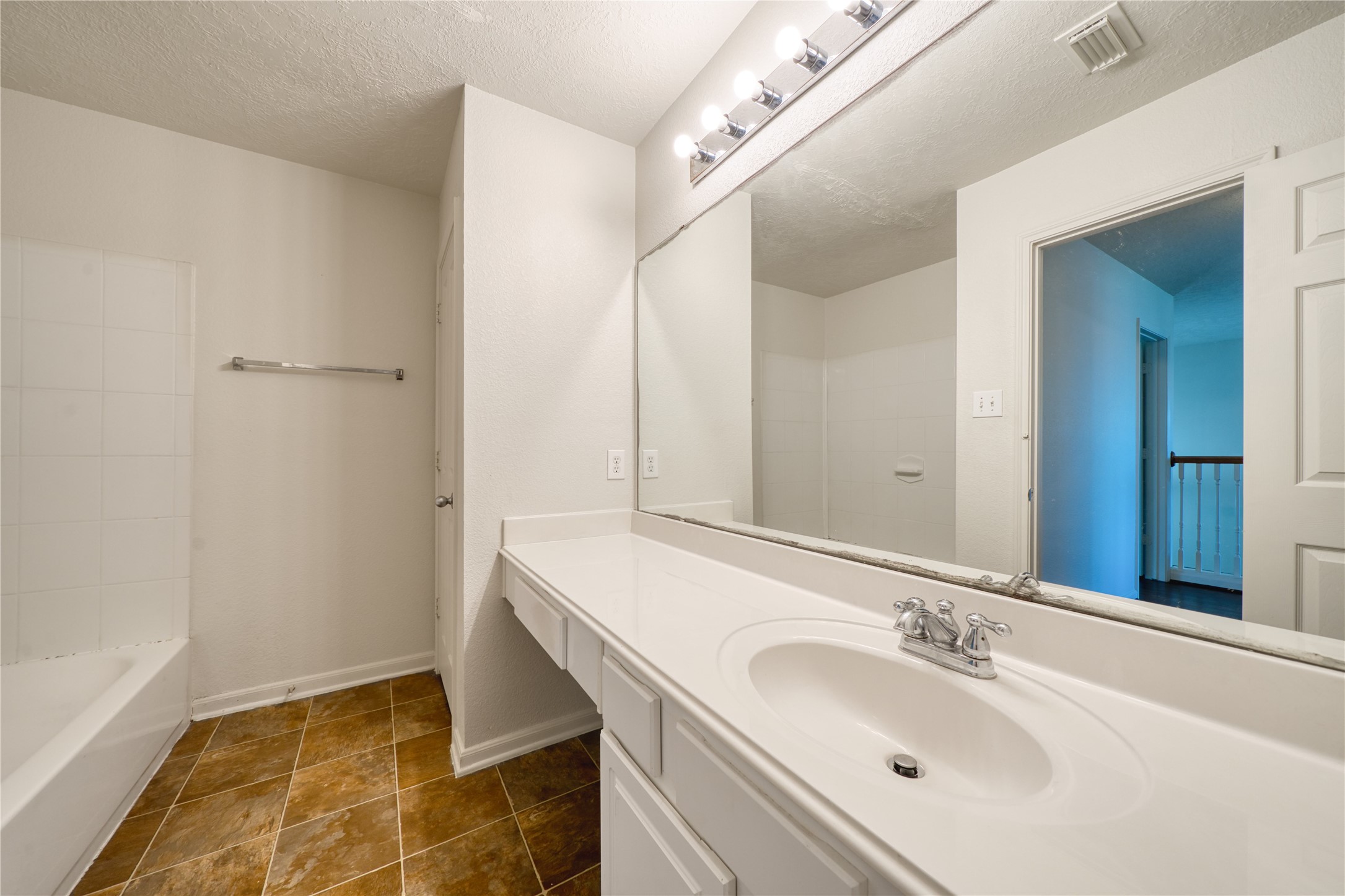 6610 Autumn Sunset Lane Spring, TX 77379 - Photo 42 of 45 a bathroom with a sink and a mirror
