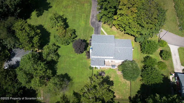 a bathroom with a tub and a shower curtain