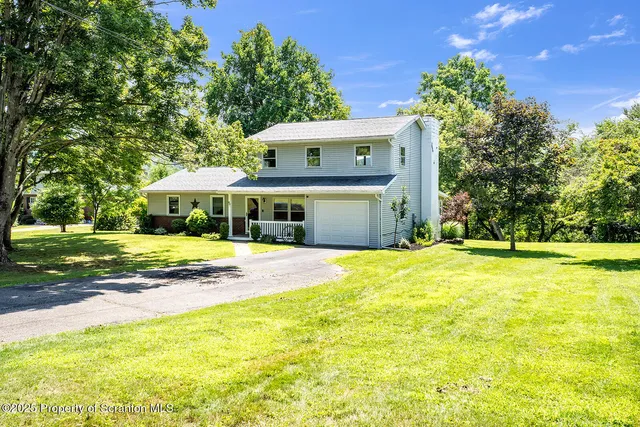 a view of a house with a swimming pool