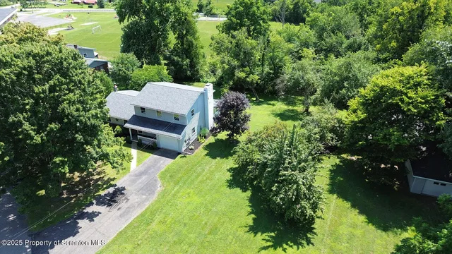 a kitchen with stainless steel appliances granite countertop a white stove top oven and sink