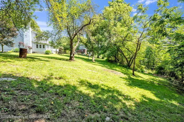 a view of a hallway with stairs