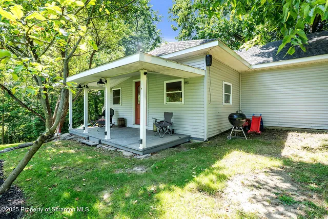 a bathroom with a sink window and mirror