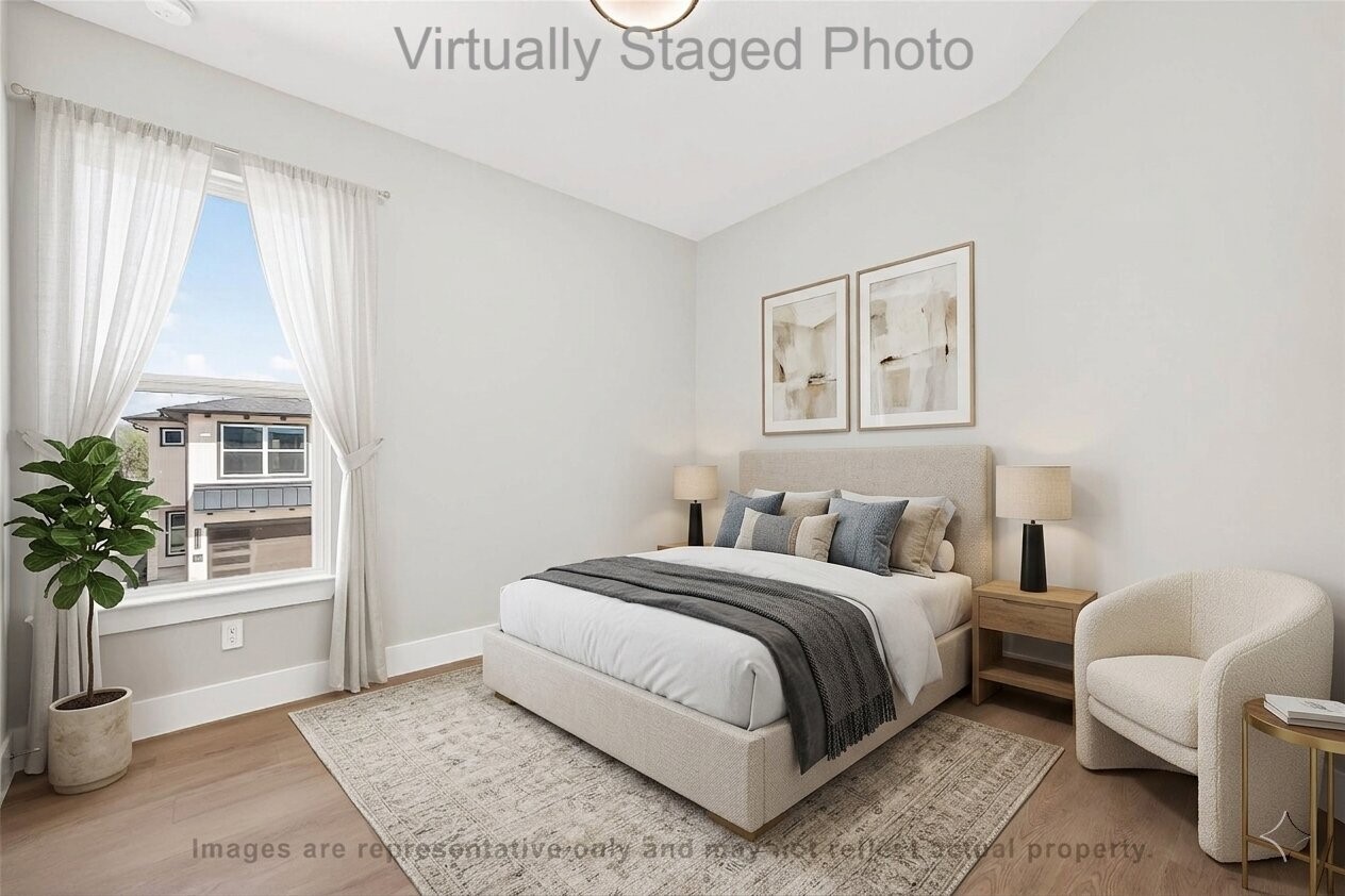 10719 Mason Road, Unit 39 Richmond, TX 77406 - Photo 13 of 50 Virtual Staging - Neutral bedroom featuring an upholstered bed, matching wood nightstands, a cozy cream armchair, and a large window dressed with sheer white curtains