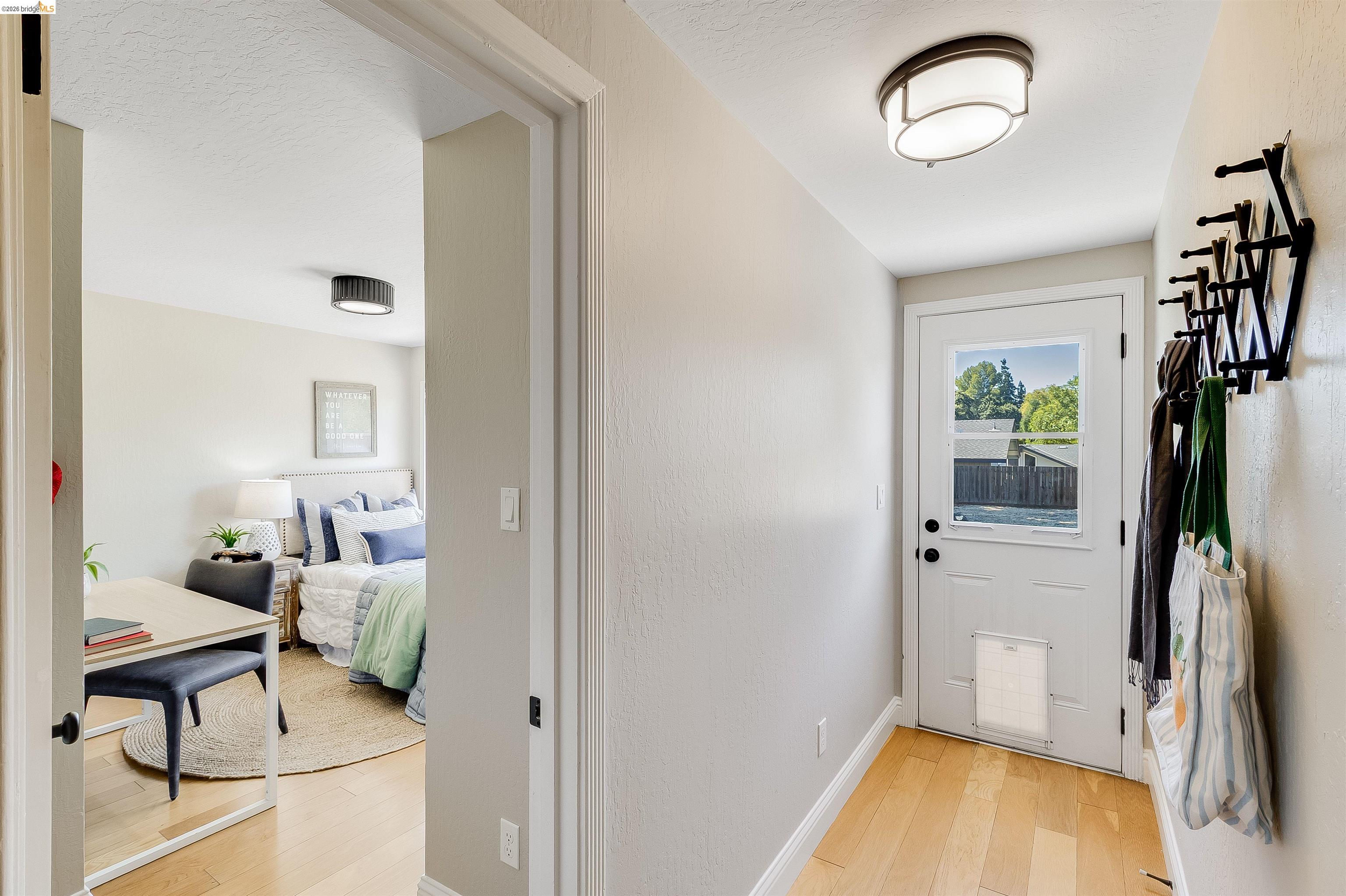 346 Valley View Road Pleasant Hill, CA 94523 - Photo 32 of 57 Entryway featuring light wood-finish flooring and a white paneled door with an integrated window