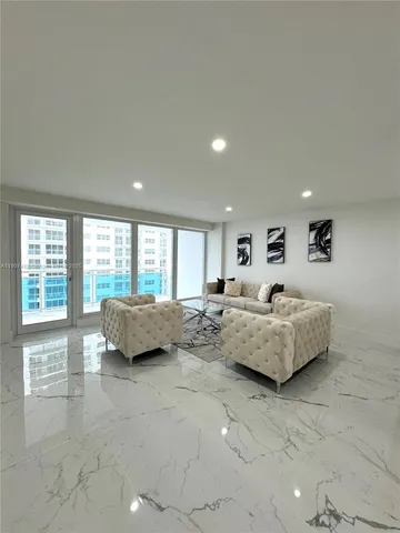 a spacious bedroom with a bed and a couch