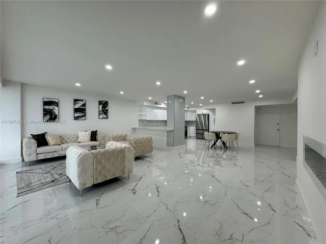 a living room with furniture and a table