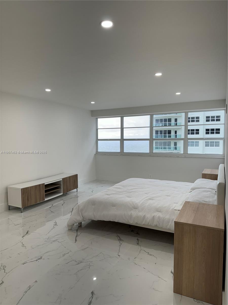 3430 Galt Ocean Drive, Unit 908 Fort Lauderdale, FL 33308 - Photo 10 of 17 a bedroom with a bed and a dresser in it