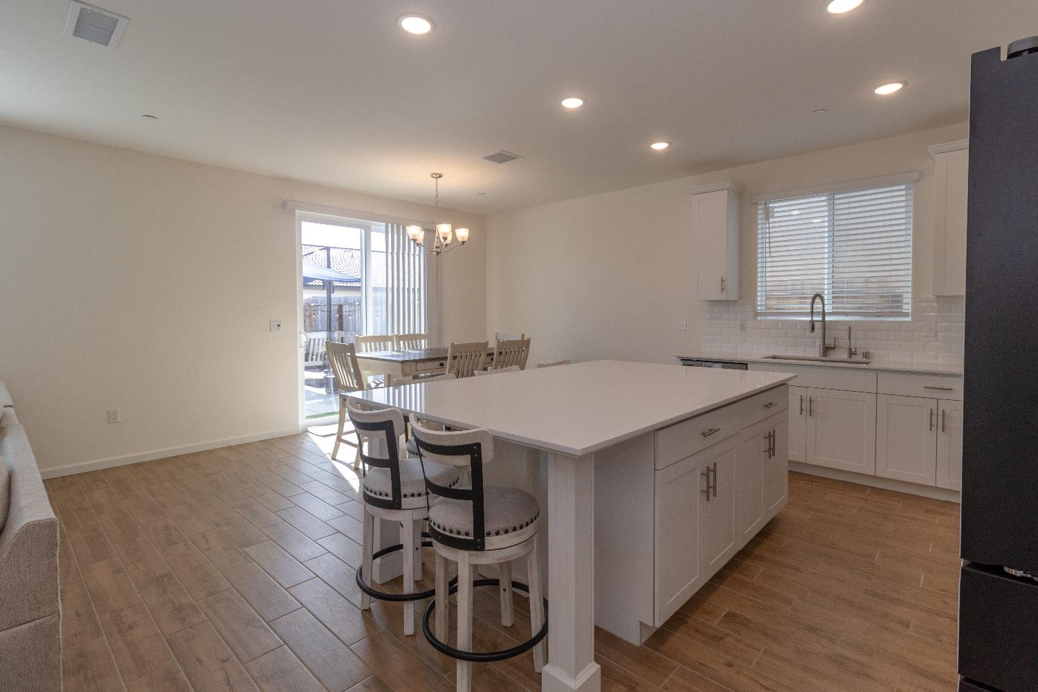 1158 Encore Way West Madera, CA 93636 - Photo 10 of 45 a kitchen with a sink a counter space and appliances
