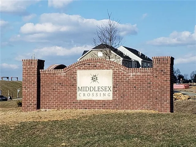 a view of a brick building with many windows