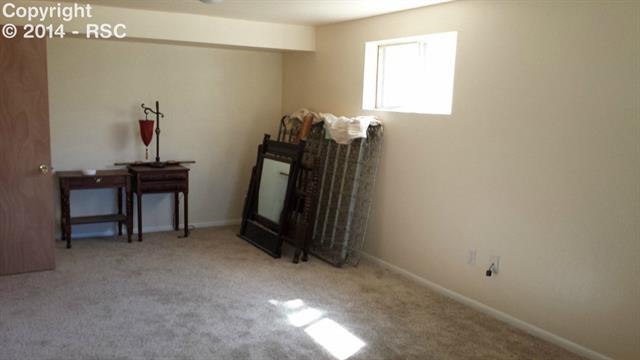 7512 Tudor Road Colorado Springs, CO 80919 - Photo 13 of 17 3rd Bedroom w/ Walk-In Closet & Attached Bathroom