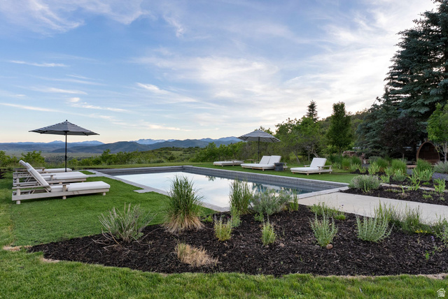 5971 Maple Ridge Trail Oakley, UT 84055 - Photo 8 of 43 Rectangular inground swimming pool set within a manicured lawn