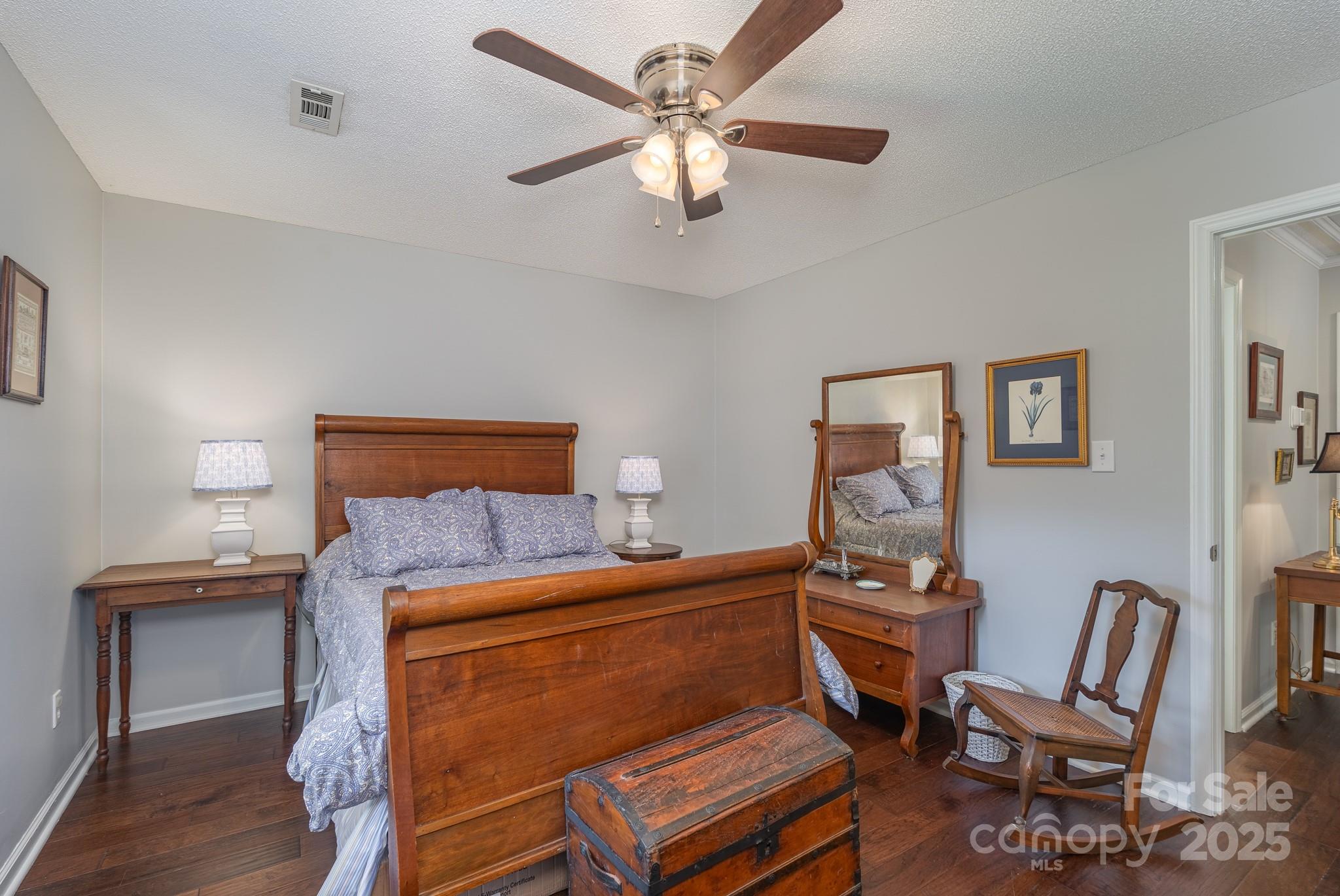 201 Pointe Circle Rock Hill, SC 29732 - Photo 21 of 32 a bedroom with a bed and a chandelier