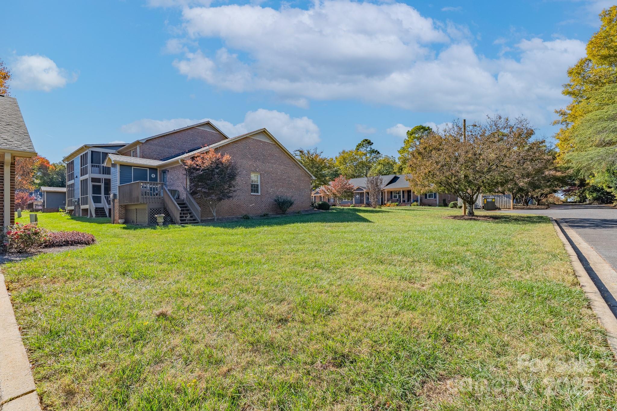 201 Pointe Circle Rock Hill, SC 29732 - Photo 25 of 32 a view of a house with a big yard and large trees