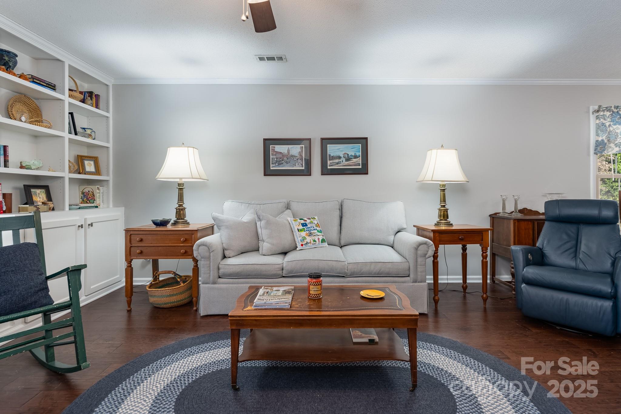 201 Pointe Circle Rock Hill, SC 29732 - Photo 6 of 32 a living room with furniture a lamp and a bookshelf