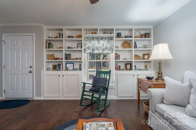a room with furniture and a book shelf