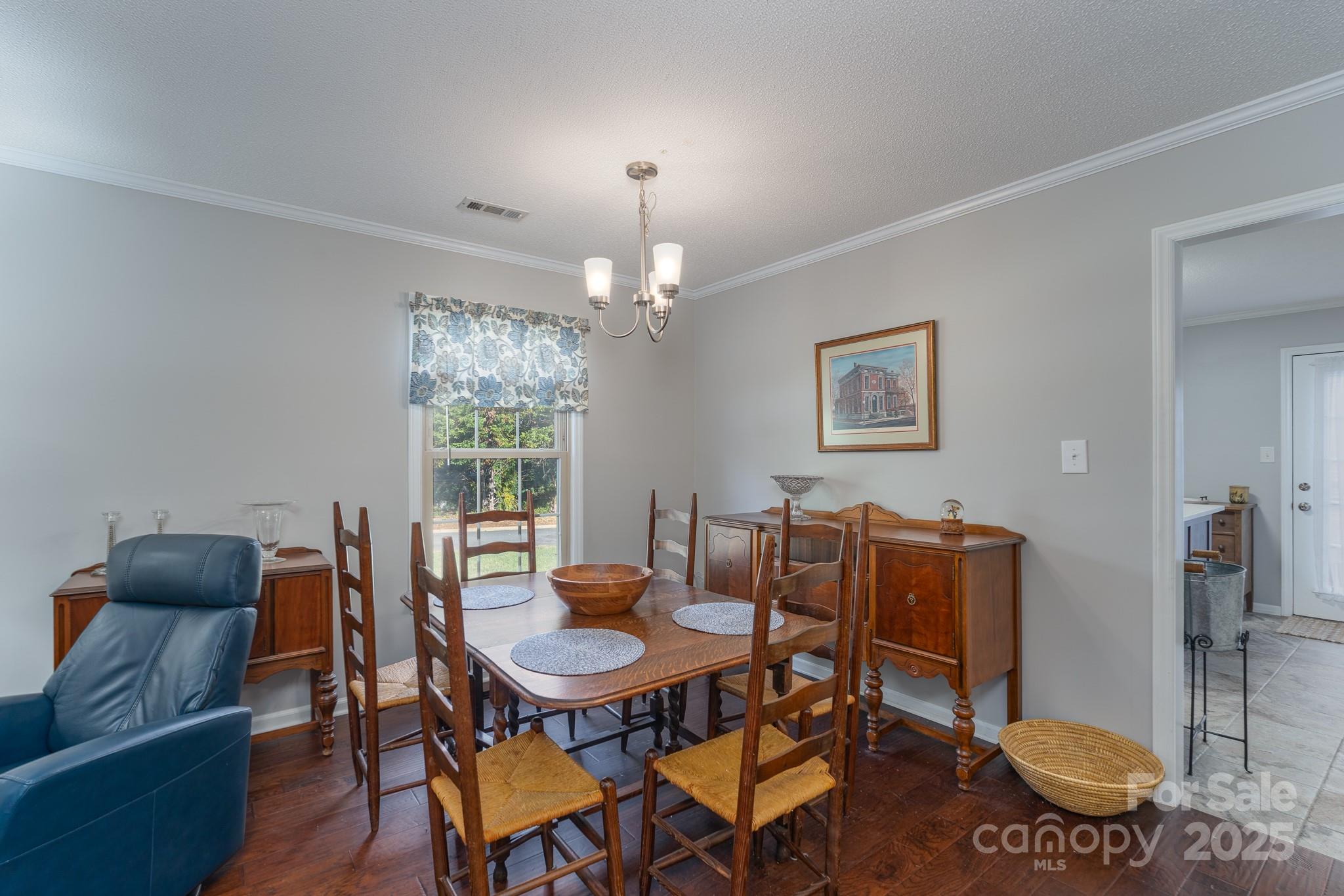 201 Pointe Circle Rock Hill, SC 29732 - Photo 8 of 32 a dining room with furniture a chandelier and window