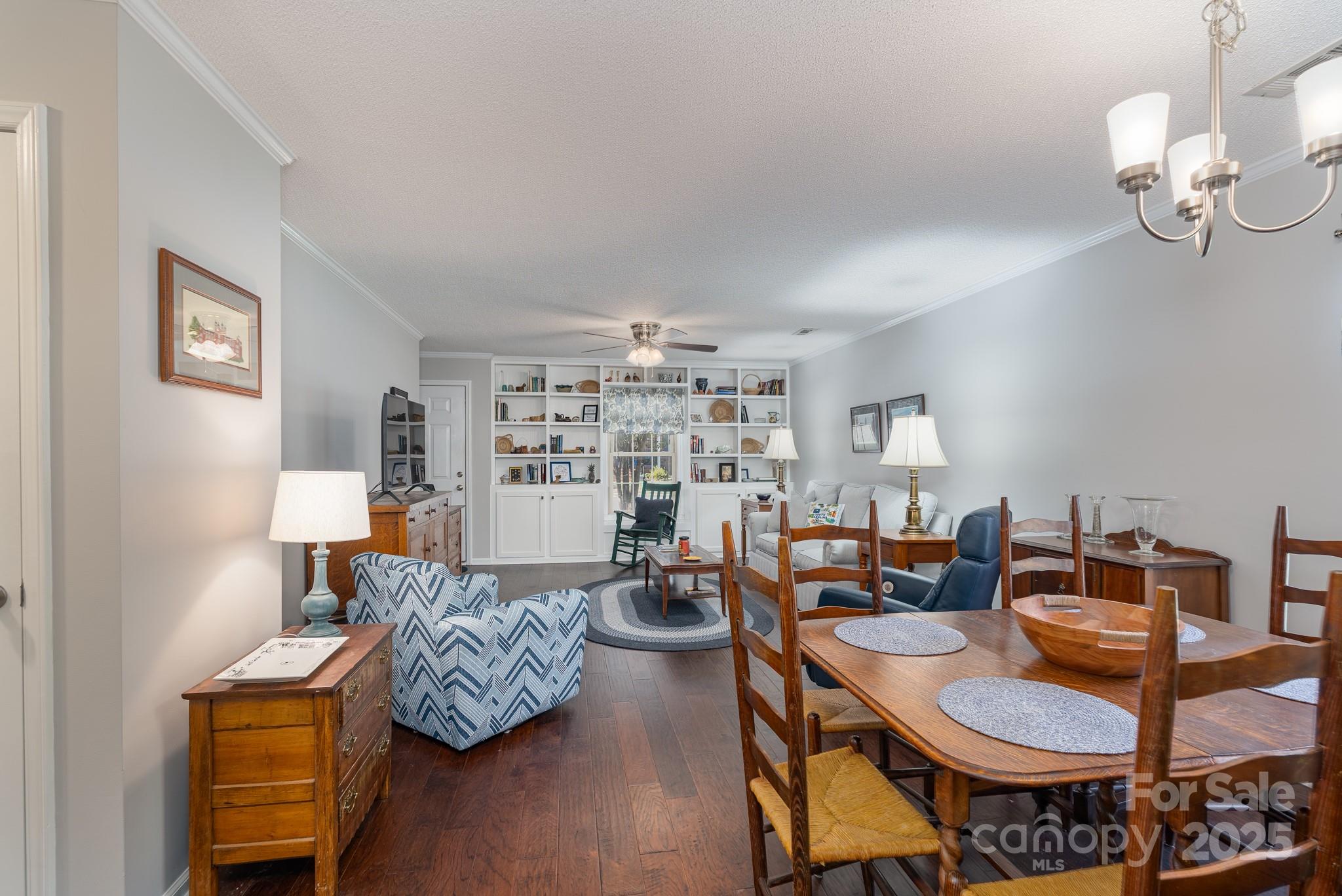 201 Pointe Circle Rock Hill, SC 29732 - Photo 9 of 32 a living room with furniture and a chandelier