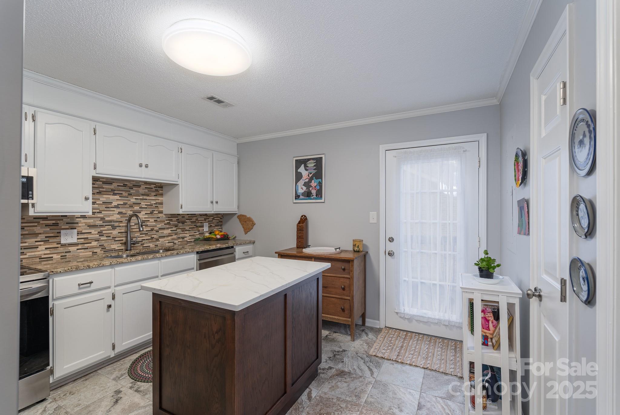 201 Pointe Circle Rock Hill, SC 29732 - Photo 10 of 32 a kitchen with a sink stove and cabinets