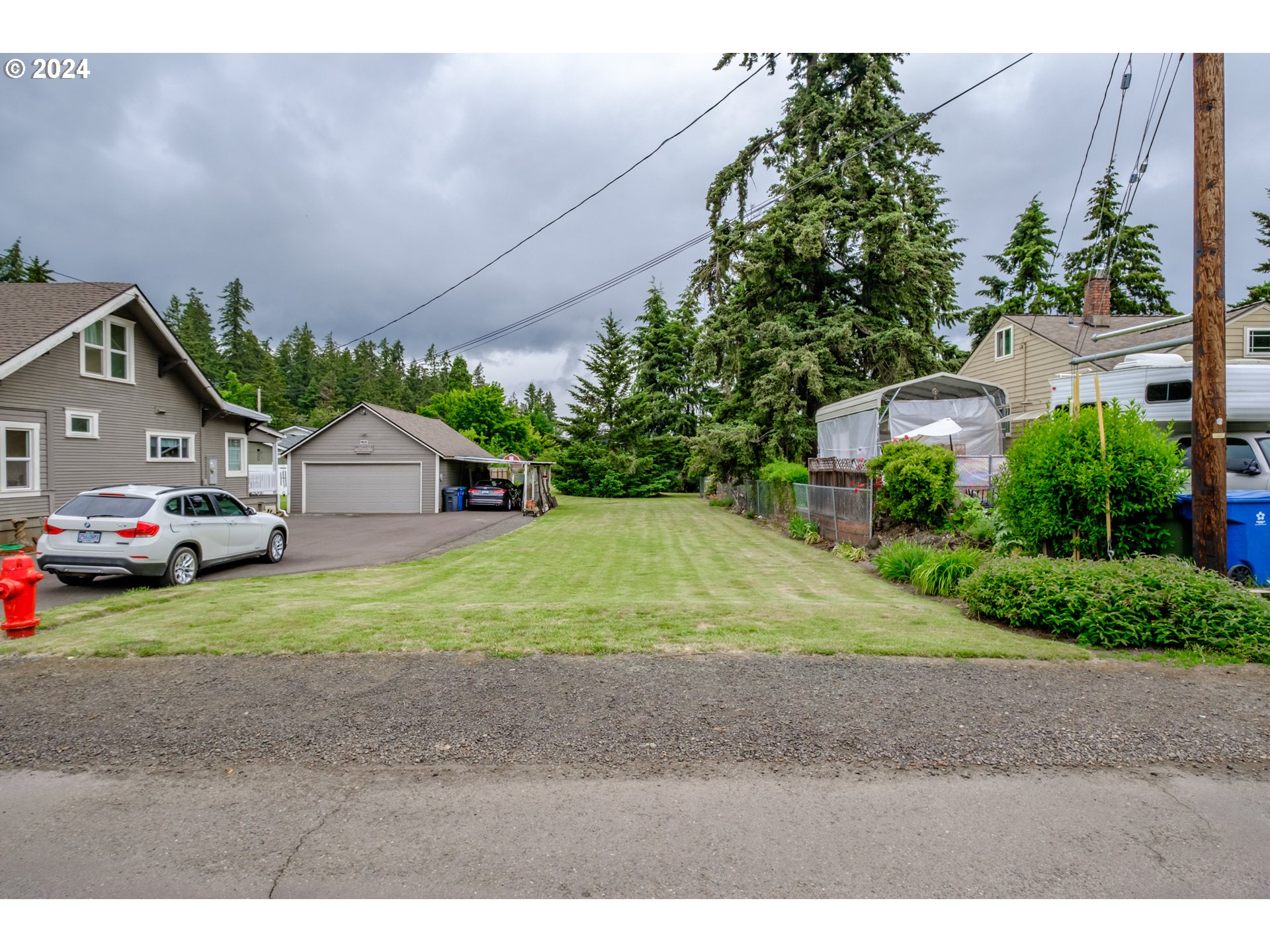 Cowing Silverton, OR 97381 - Photo 16 of 27 a yellow and red house sitting in the middle of a field