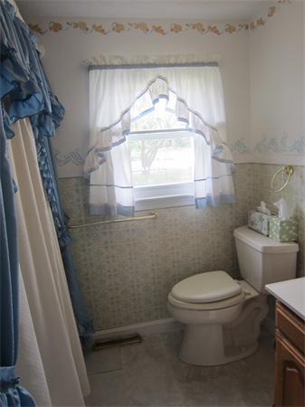 22 Agawam Beach Road Wareham, MA 02571 - Photo 12 of 16 a bathroom with a toilet and a sink