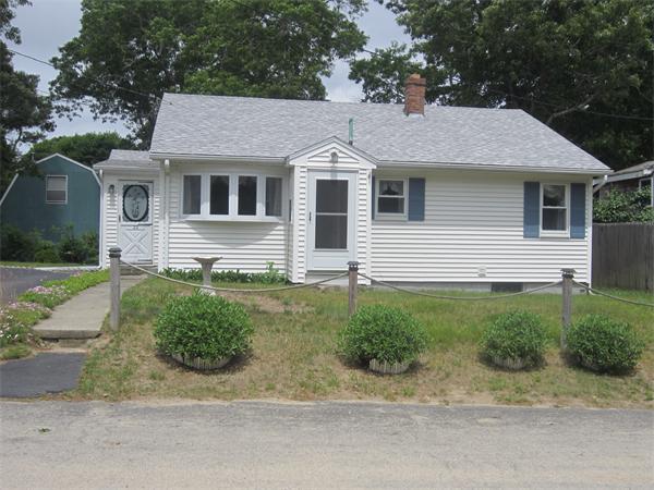 22 Agawam Beach Road Wareham, MA 02571 - Photo 13 of 16 front view of a house with a yard