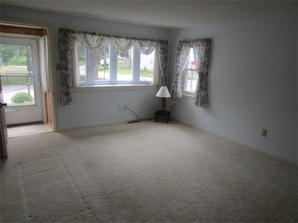 22 Agawam Beach Road Wareham, MA 02571 - Photo 5 of 16 an empty room with windows