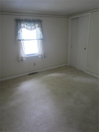 22 Agawam Beach Road Wareham, MA 02571 - Photo 8 of 16 an empty room with a window