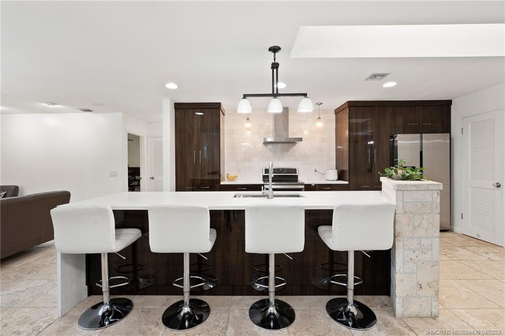 40 North River Road Stuart, FL 34996 - Photo 13 of 51 a kitchen with a sink cabinets and window