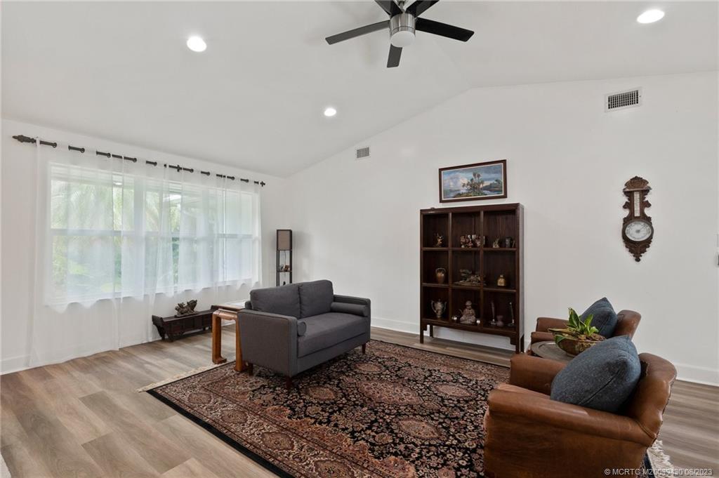 40 North River Road Stuart, FL 34996 - Photo 21 of 51 a living room with furniture and a wooden floor