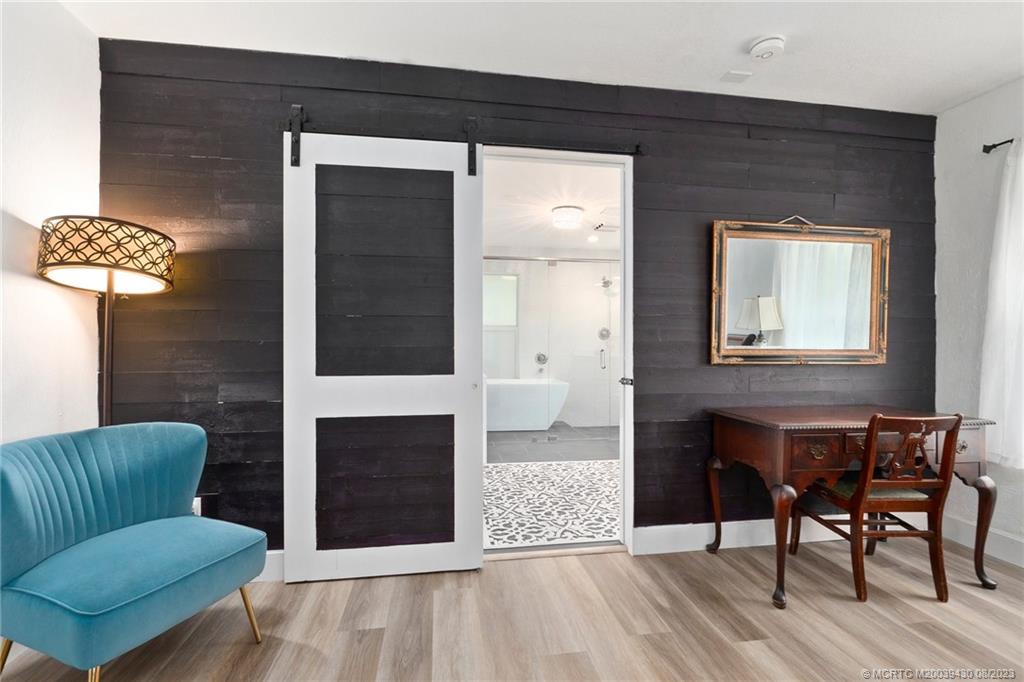 40 North River Road Stuart, FL 34996 - Photo 24 of 51 a living room with furniture and a fireplace