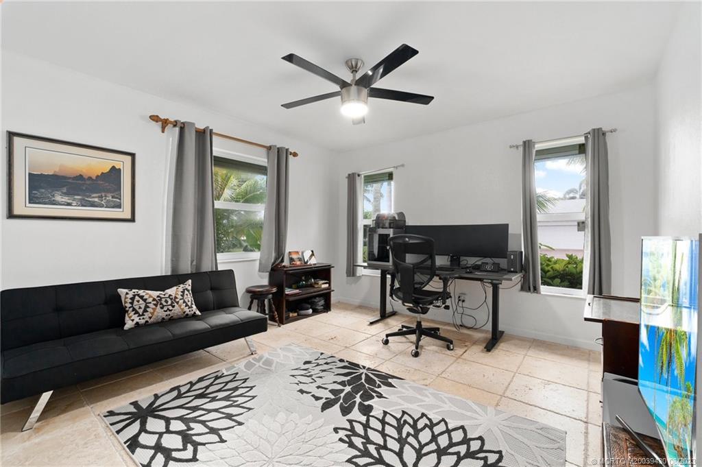 40 North River Road Stuart, FL 34996 - Photo 31 of 51 a living room with furniture and wooden floor