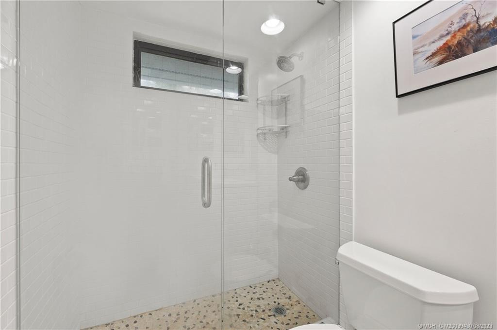 40 North River Road Stuart, FL 34996 - Photo 34 of 51 a bathroom with a toilet and shower