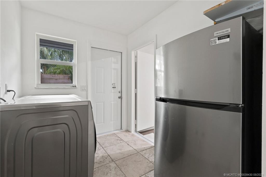 40 North River Road Stuart, FL 34996 - Photo 35 of 51 a utility room with dryer and washer