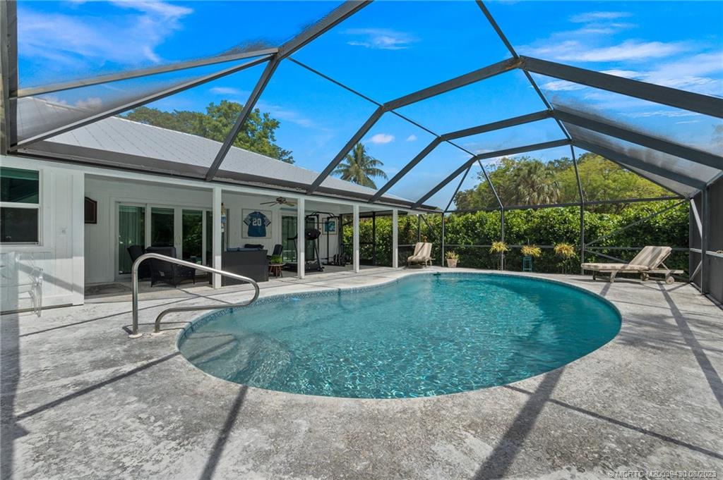 40 North River Road Stuart, FL 34996 - Photo 39 of 51 a view of a swimming pool with a patio