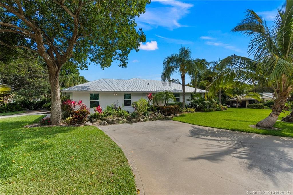 40 North River Road Stuart, FL 34996 - Photo 45 of 51 a view of a house with a yard