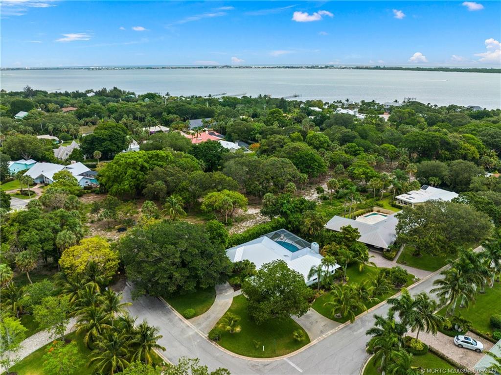 40 North River Road Stuart, FL 34996 - Photo 49 of 51 an aerial view of residential houses with outdoor space and trees