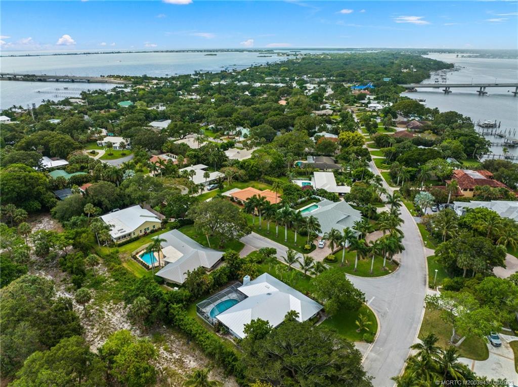 40 North River Road Stuart, FL 34996 - Photo 5 of 51 an aerial view of residential houses with outdoor space and trees