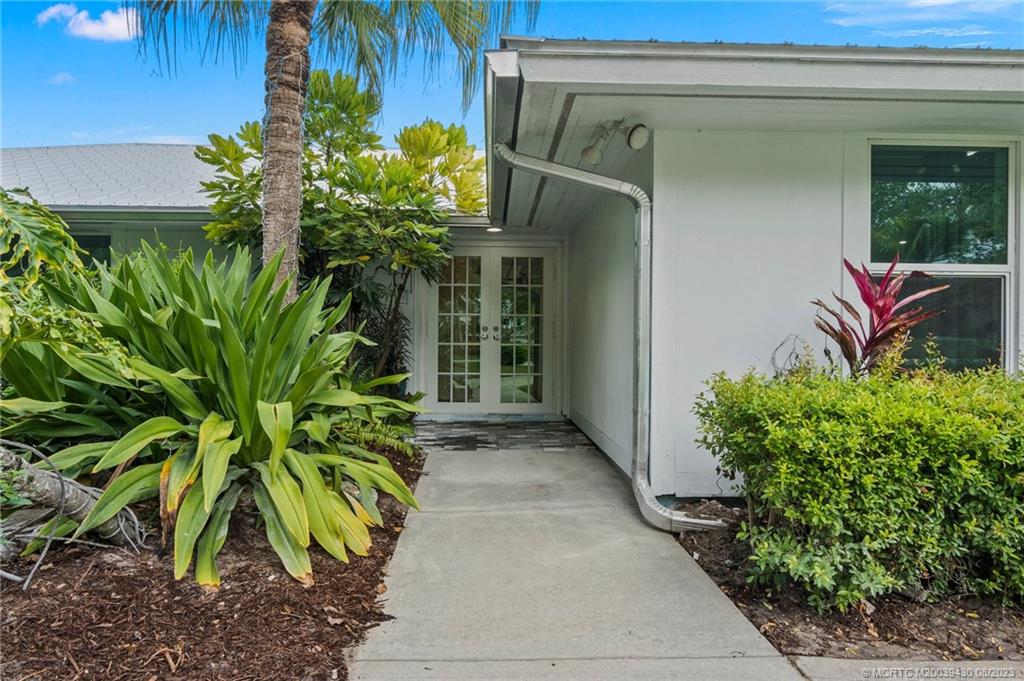 40 North River Road Stuart, FL 34996 - Photo 7 of 51 a plant is in front of a door