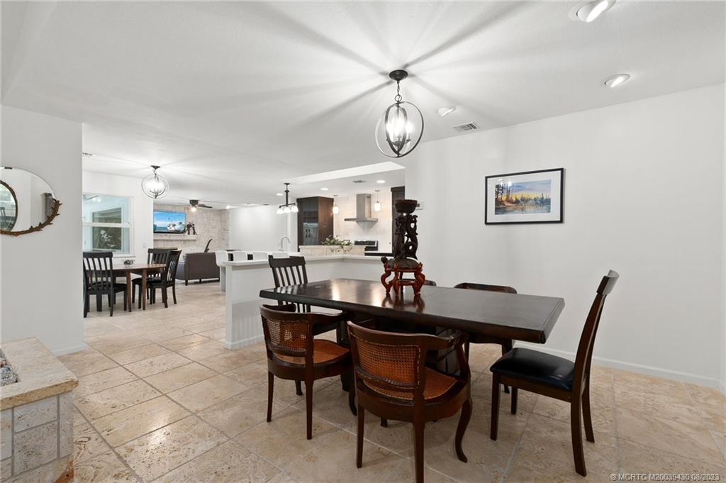 40 North River Road Stuart, FL 34996 - Photo 10 of 51 a view of a dining room and livingroom with furniture