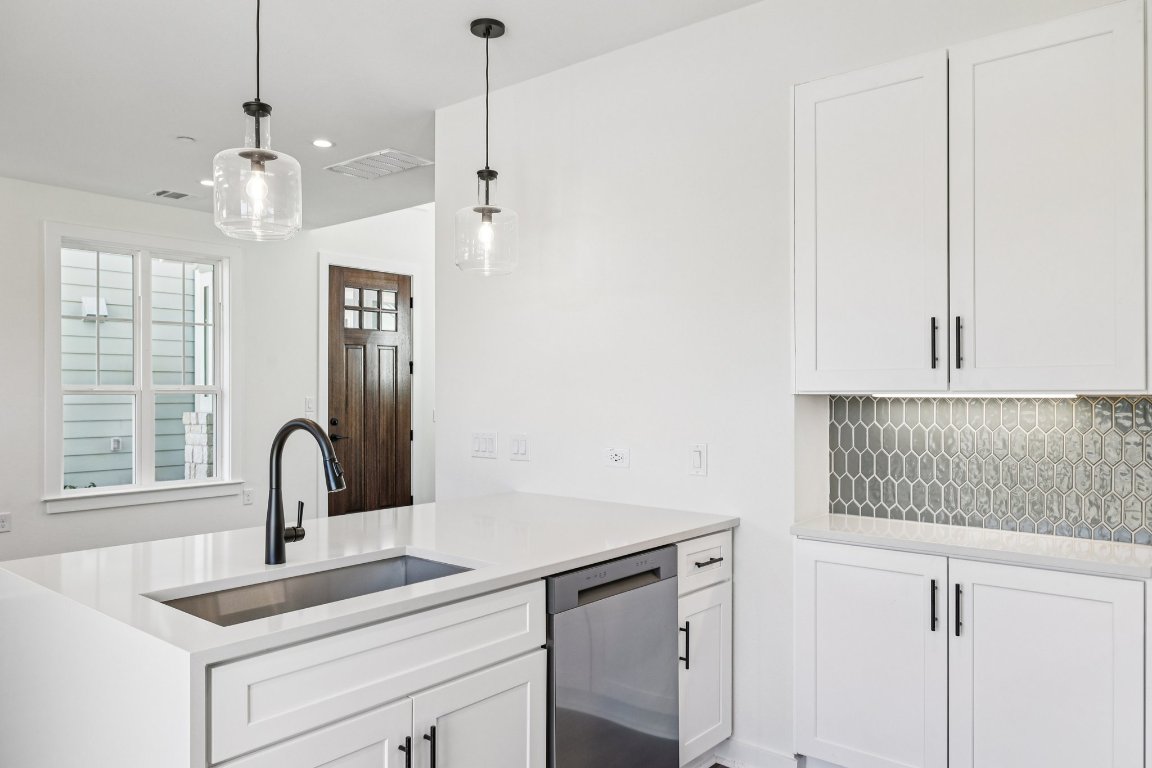 2414 Drew Lane, Unit 3 Austin, TX 78748 - Photo 14 of 38 a kitchen with a sink cabinets and window