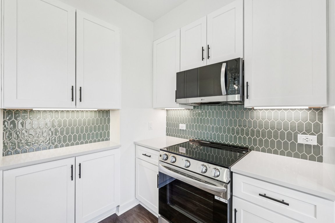 2414 Drew Lane, Unit 3 Austin, TX 78748 - Photo 15 of 38 a kitchen with a stove and a microwave