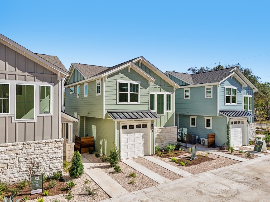 2414 Drew Lane, Unit 3 Austin, TX 78748 - Photo 31 of 38 a front view of a house with a yard and seating space