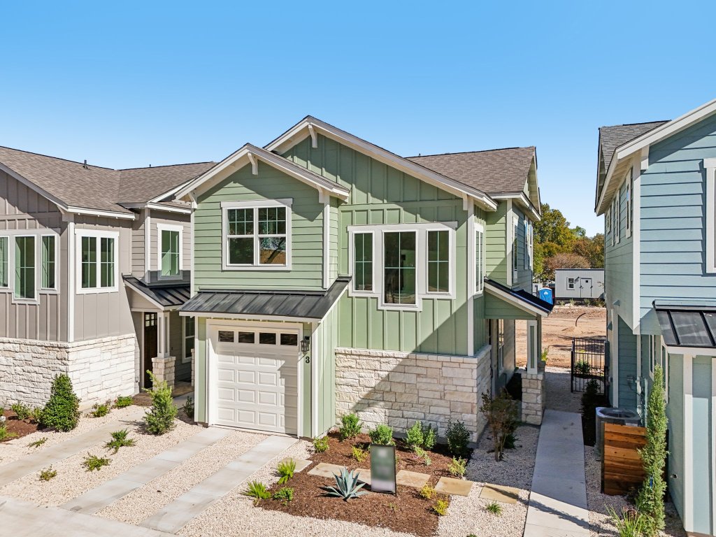 2414 Drew Lane, Unit 3 Austin, TX 78748 - Photo 32 of 38 a front view of a house with a yard