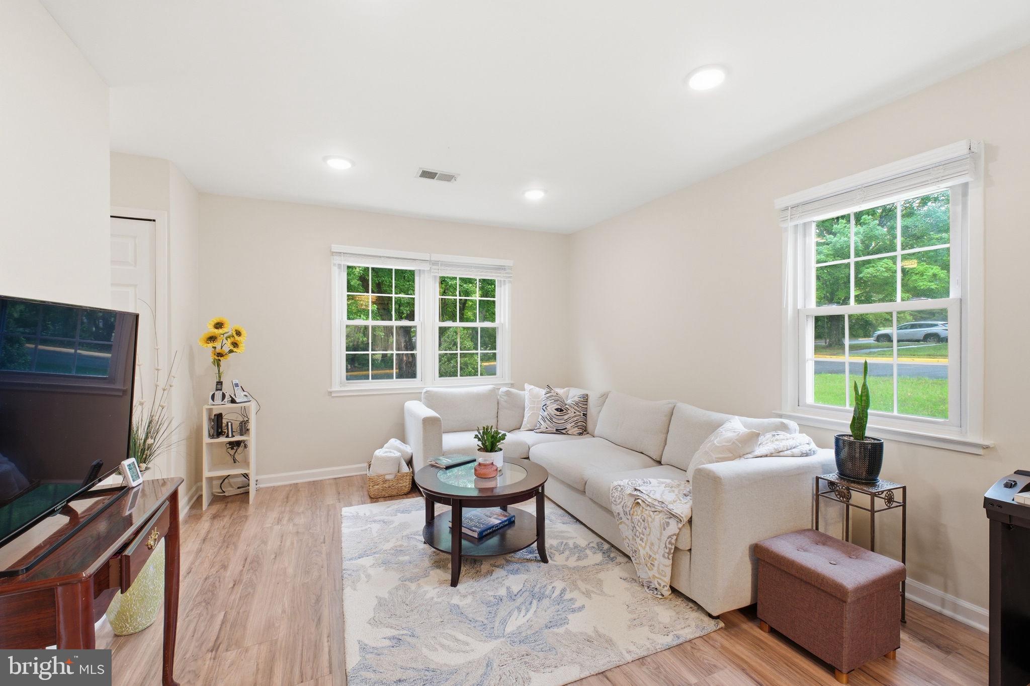 7709 Matisse Way Springfield, VA 22153 - Photo 5 of 27 Bright living room with multiple windows.