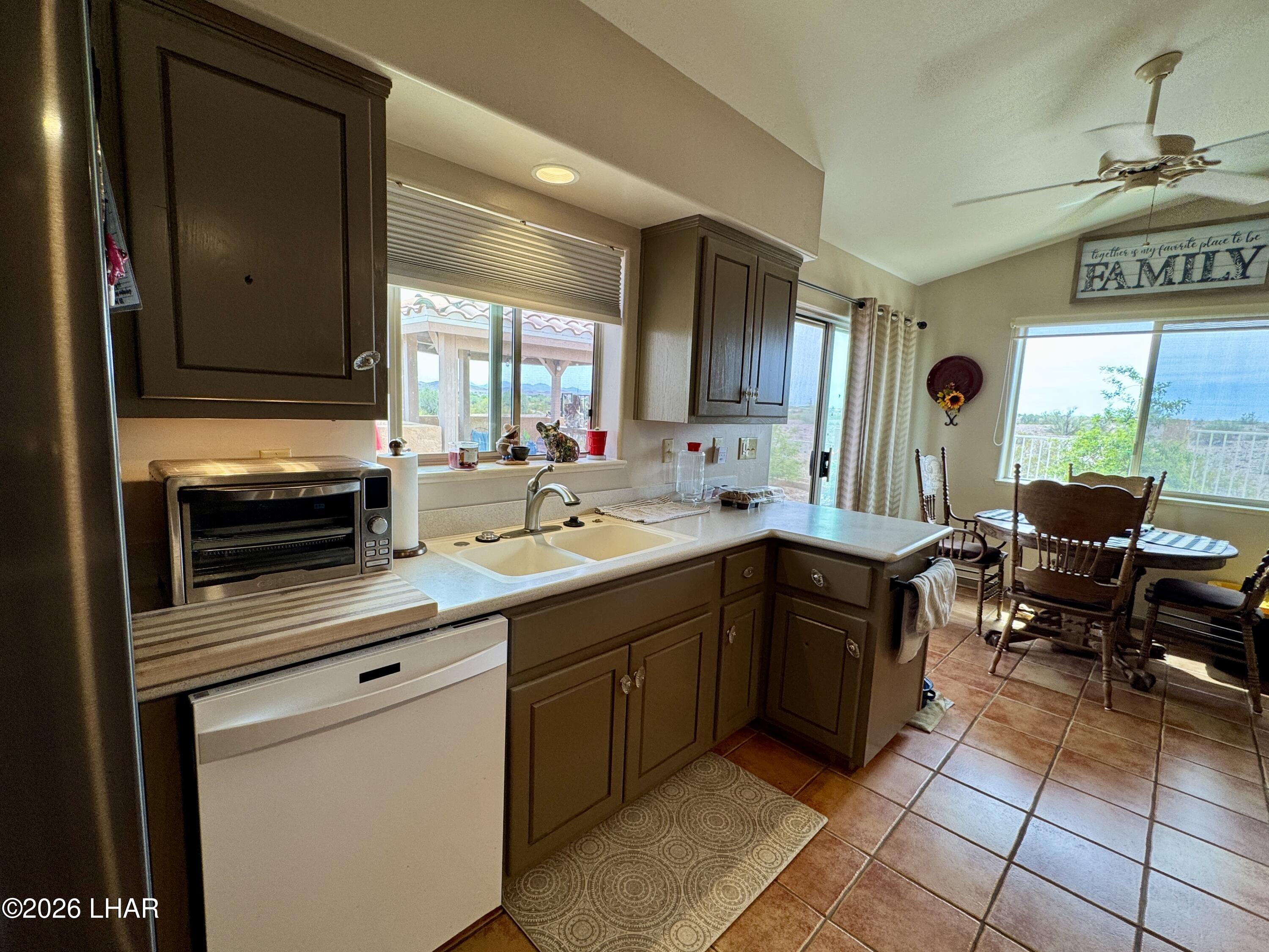 42832 La Posa Road Bouse, AZ 85325 - Photo 15 of 62 a kitchen with a sink cabinets and window