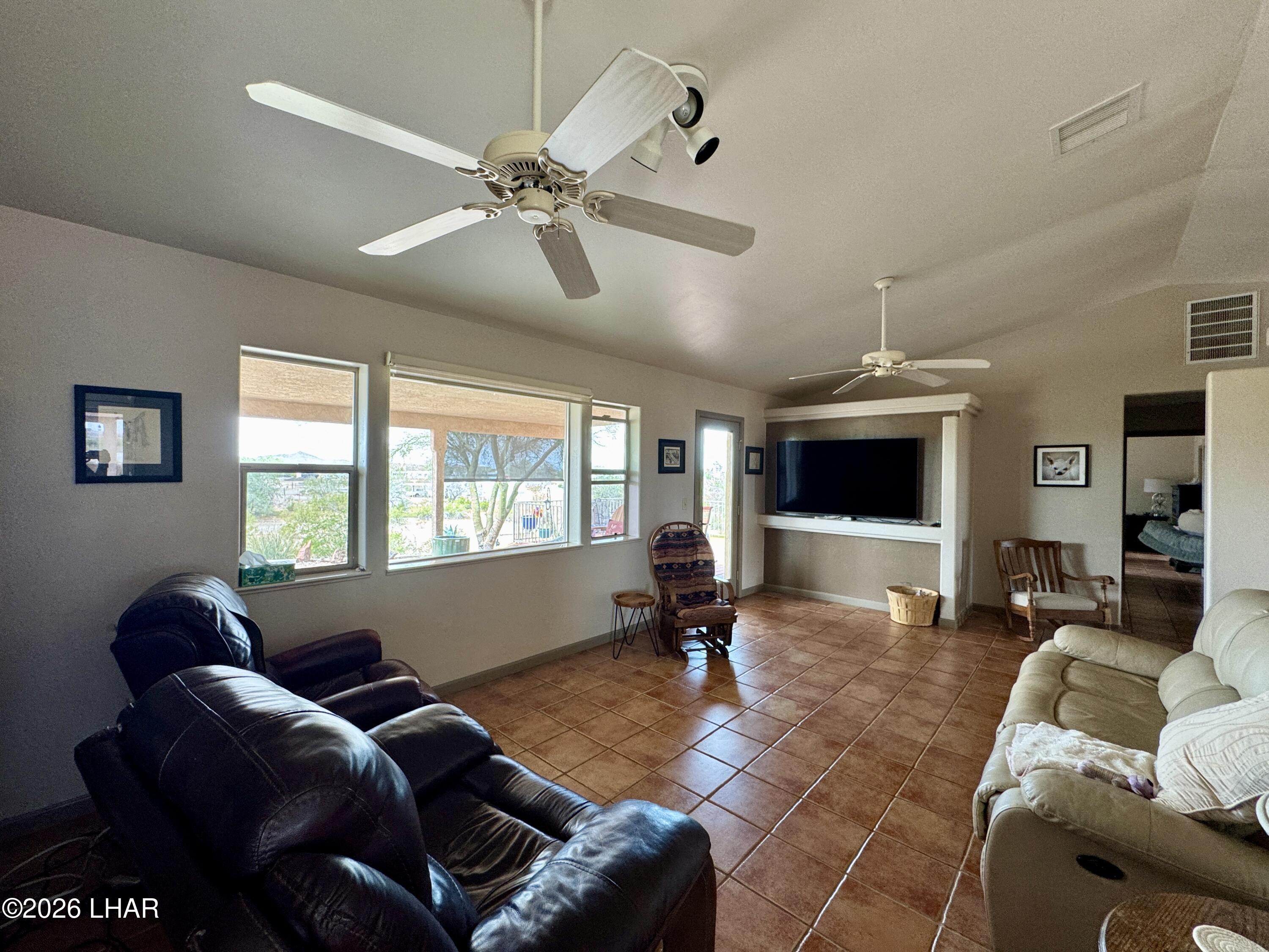 42832 La Posa Road Bouse, AZ 85325 - Photo 19 of 62 a living room with furniture and a flat screen tv