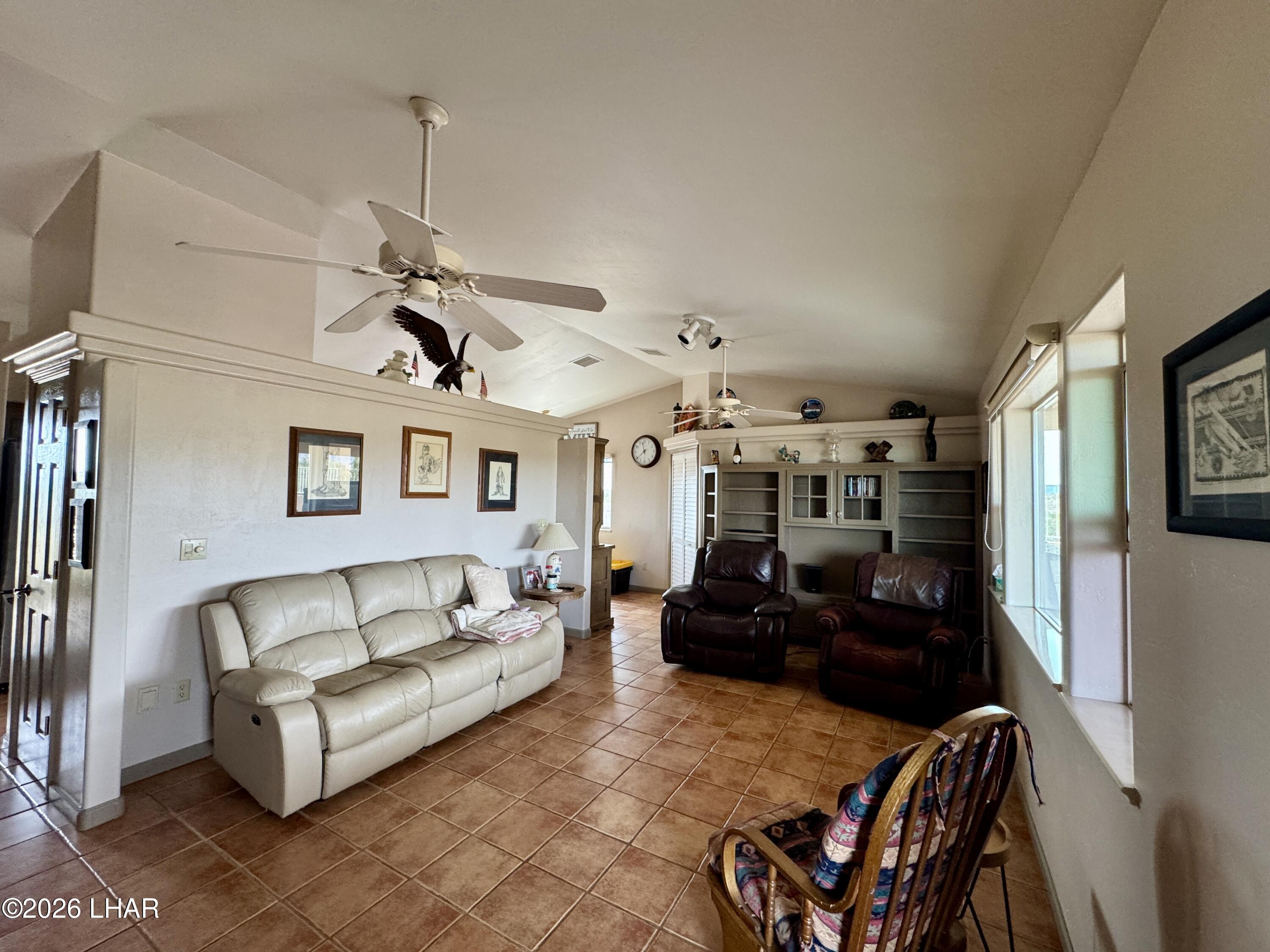 42832 La Posa Road Bouse, AZ 85325 - Photo 21 of 62 a living room with furniture and a chandelier