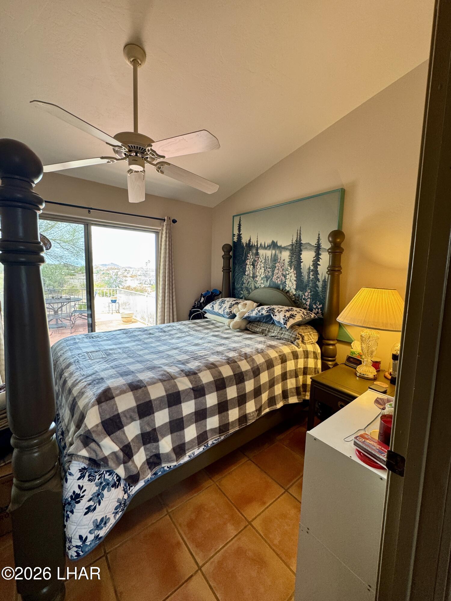 42832 La Posa Road Bouse, AZ 85325 - Photo 27 of 62 a bedroom with a bed a dresser next to a window