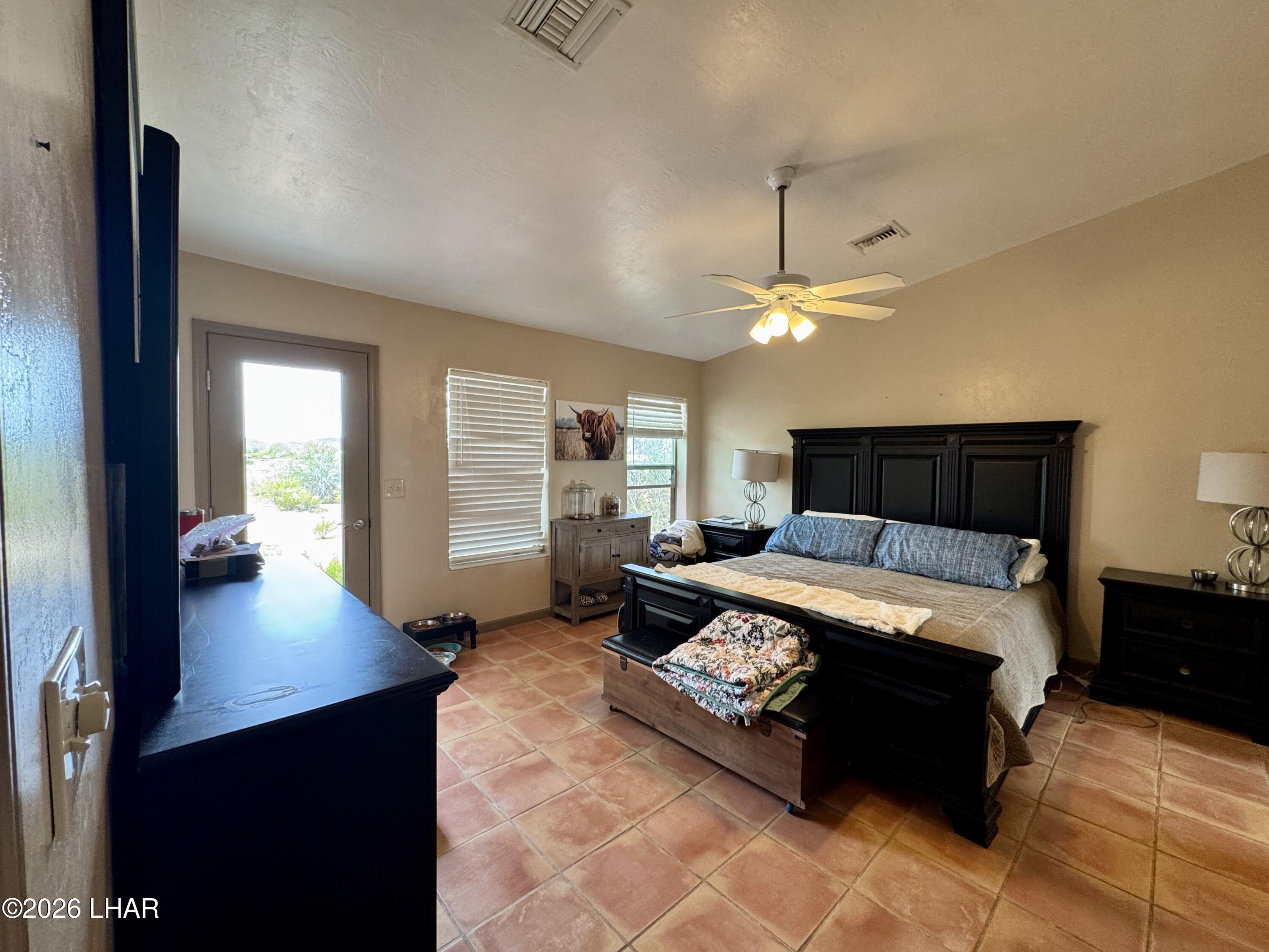 42832 La Posa Road Bouse, AZ 85325 - Photo 29 of 62 a bedroom with a bed and window